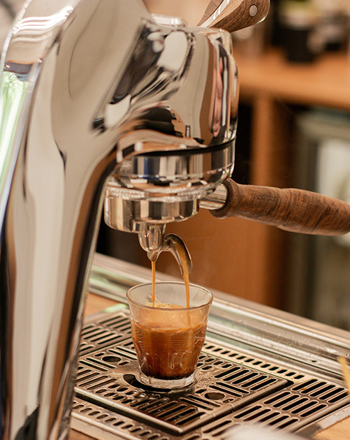 Espresso machine pouring coffee